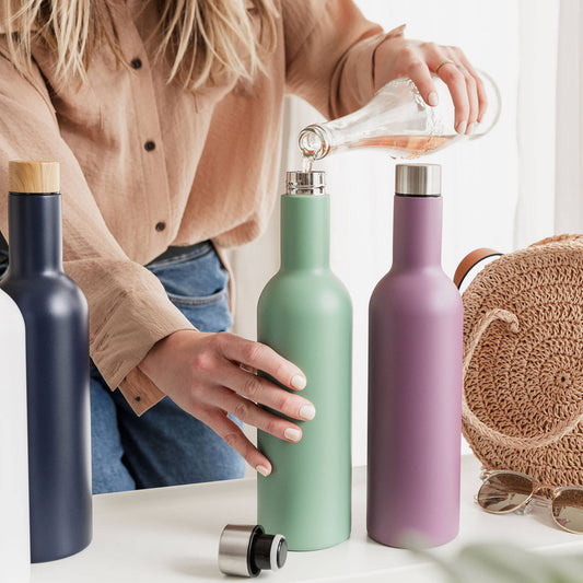 Female pouring rose wine into green insulated travel wine bottle (750ml)