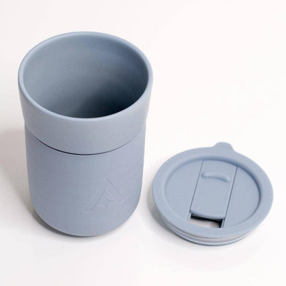 Gray silicone cup with a lid on a white background