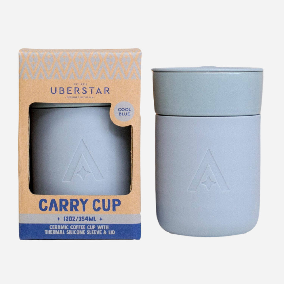 Light blue ceramic cup with thermal silicone sleeve and lid, displayed with packaging.