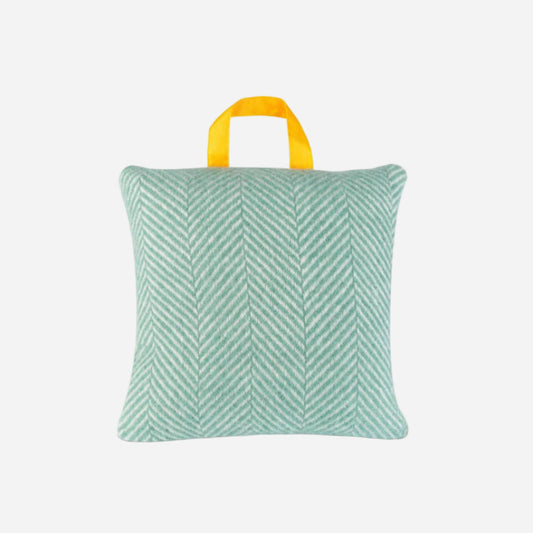 Green waterproof cushion with a yellow handle on a white background